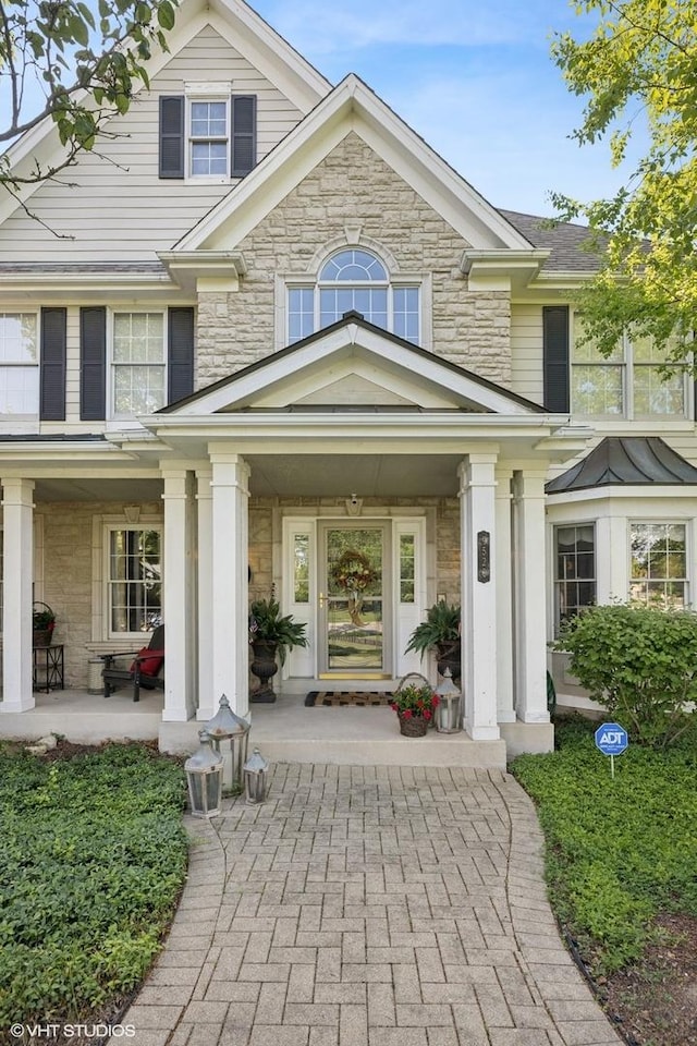 9520 Nicklaus Ln, Crystal Lake, IL 60014 - doorway to property with stone siding and a porch