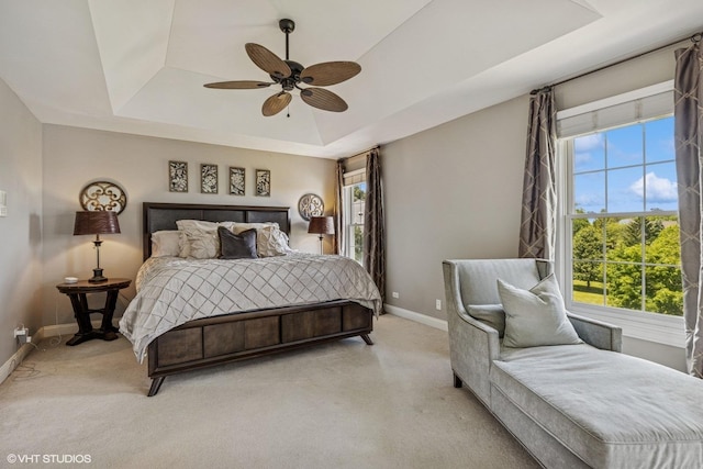 9520 Nicklaus Ln, Crystal Lake, IL 60014 - bedroom with a raised ceiling, light colored carpet, and ceiling fan