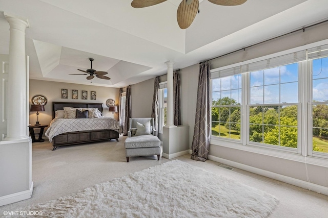 9520 Nicklaus Ln, Crystal Lake, IL 60014 - carpeted bedroom featuring a tray ceiling, ornate columns, and a ceiling fan