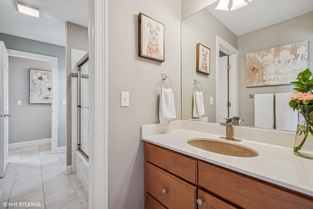 9520 Nicklaus Ln, Crystal Lake, IL 60014 - full bath with tile patterned flooring, vanity, and bath / shower combo with glass door