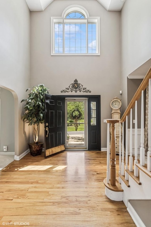 9520 Nicklaus Ln, Crystal Lake, IL 60014 - entrance foyer with a towering ceiling, wood finished floors, healthy amount of natural light, and stairs