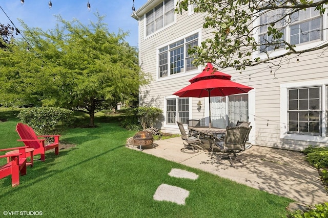 9520 Nicklaus Ln, Crystal Lake, IL 60014 - view of green lawn with a fire pit and a patio area