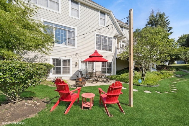 9520 Nicklaus Ln, Crystal Lake, IL 60014 - rear view of property with a fire pit, a yard, a patio, and a chimney