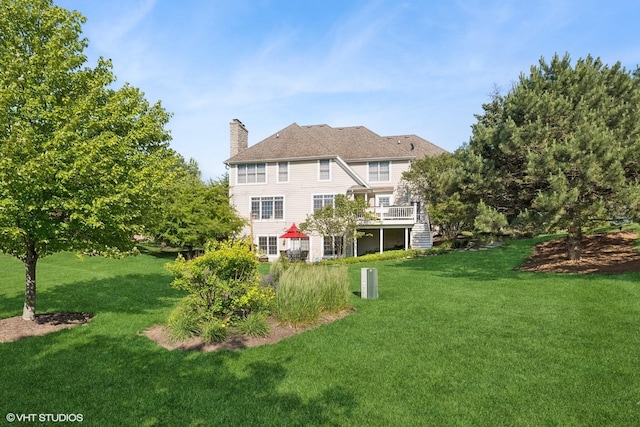 9520 Nicklaus Ln, Crystal Lake, IL 60014 - rear view of property featuring a chimney, stairs, a lawn, and a deck
