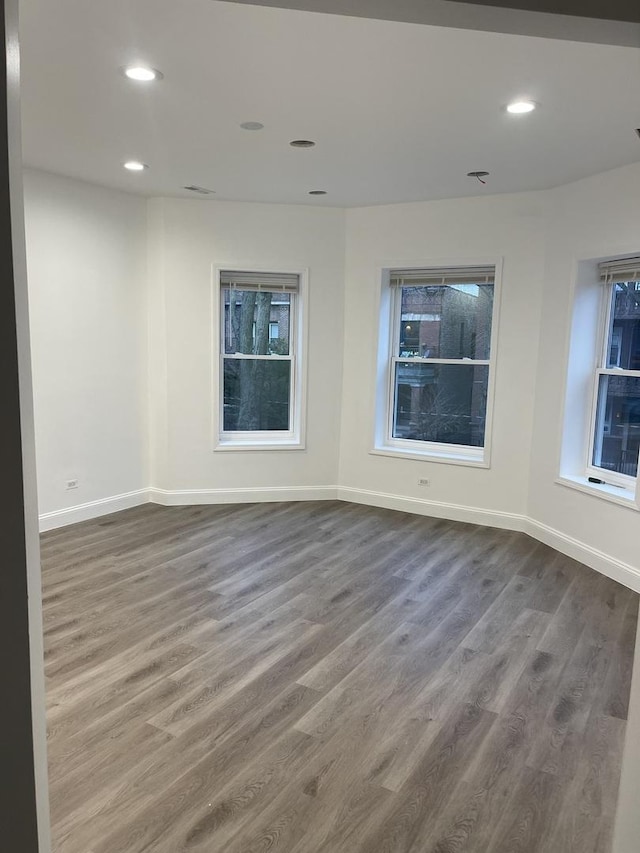 6141 S Eberhart Ave, Chicago, IL 60637 - unfurnished room with wood finished floors, baseboards, and recessed lighting