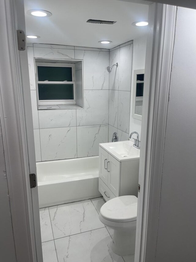 6141 S Eberhart Ave, Chicago, IL 60637 - bathroom featuring marble look tile flooring, vanity,  shower combination, toilet, and recessed lighting