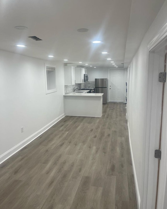 6141 S Eberhart Ave, Chicago, IL 60637 - unfurnished living room featuring baseboards, wood finished floors, and recessed lighting