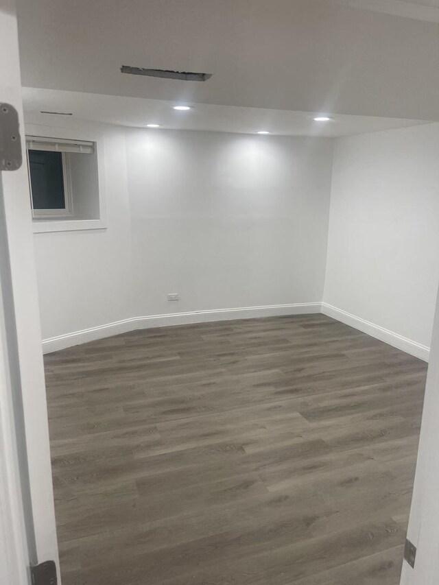 6141 S Eberhart Ave, Chicago, IL 60637 - finished basement with baseboards, dark wood-style floors, and recessed lighting