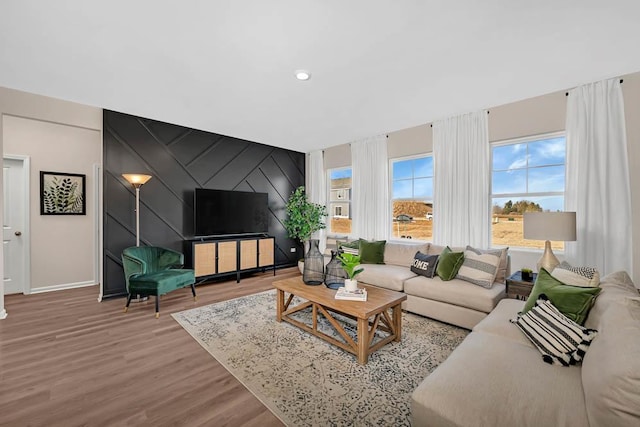 298 Astor Ct, Elgin, IL 60124 - living area with an accent wall, wood finished floors, and recessed lighting