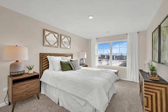 298 Astor Ct, Elgin, IL 60124 - bedroom featuring light colored carpet and baseboards