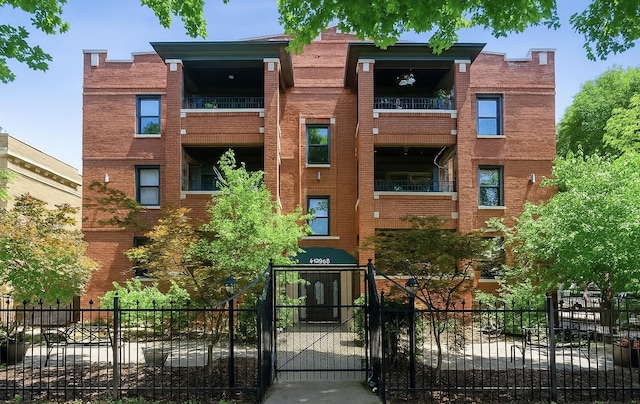 3405 N Harding Ave Unit 1, Chicago, IL 60618 - view of apartment building / complex with a fenced front yard
