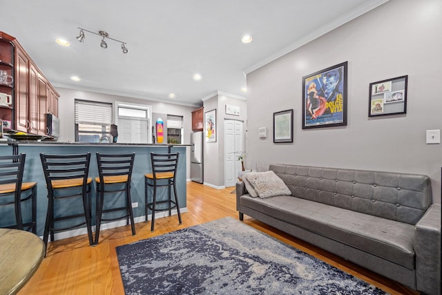 3405 N Harding Ave Unit 1, Chicago, IL 60618 - living room featuring ornamental molding, light wood-style floors, recessed lighting, and baseboards