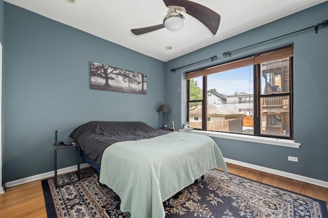 3405 N Harding Ave Unit 1, Chicago, IL 60618 - bedroom featuring baseboards, wood finished floors, and a ceiling fan
