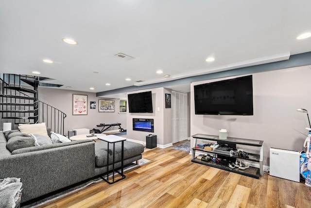 3405 N Harding Ave Unit 1, Chicago, IL 60618 - living area featuring stairway, wood finished floors, recessed lighting, a glass covered fireplace, and baseboards
