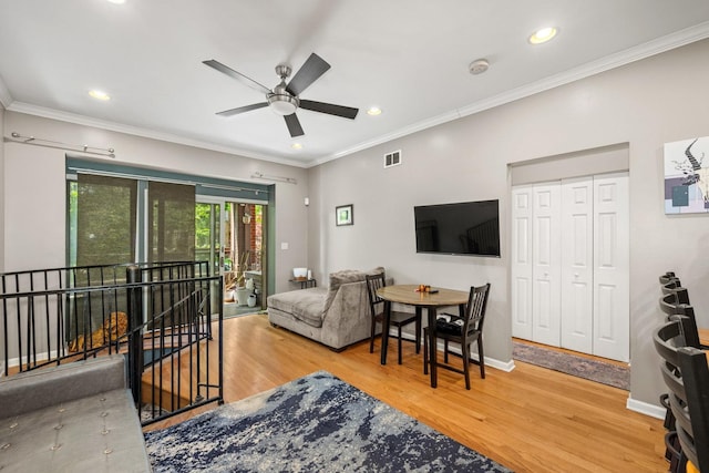 3405 N Harding Ave Unit 1, Chicago, IL 60618 - living room with wood finished floors, ceiling fan, recessed lighting, crown molding, and baseboards