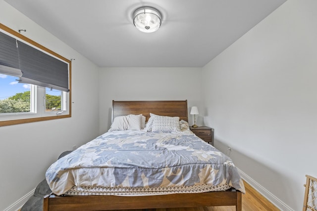 5209 S Narragansett Ave, Chicago, IL 60638 - bedroom with baseboards and wood finished floors