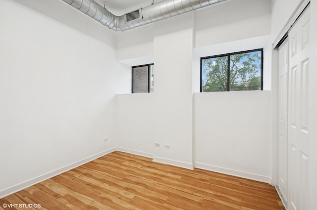 4537 S Drexel Blvd Unit 106, Chicago, IL 60653 - unfurnished room featuring light wood finished floors and a high ceiling