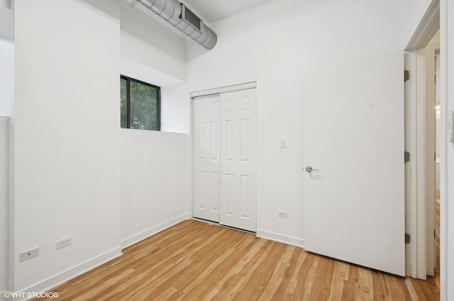 4537 S Drexel Blvd Unit 106, Chicago, IL 60653 - unfurnished bedroom with wood finished floors and a closet