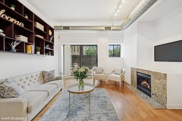 4537 S Drexel Blvd Unit 106, Chicago, IL 60653 - living area featuring a high end fireplace and wood finished floors