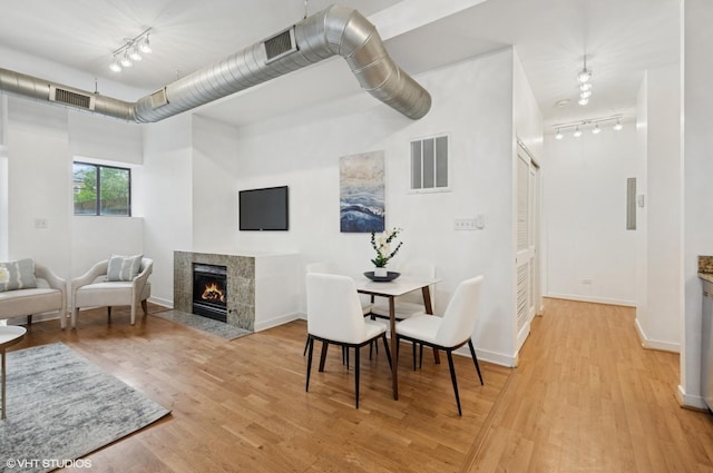 4537 S Drexel Blvd Unit 106, Chicago, IL 60653 - sitting room with rail lighting, light wood-style floors, and a fireplace