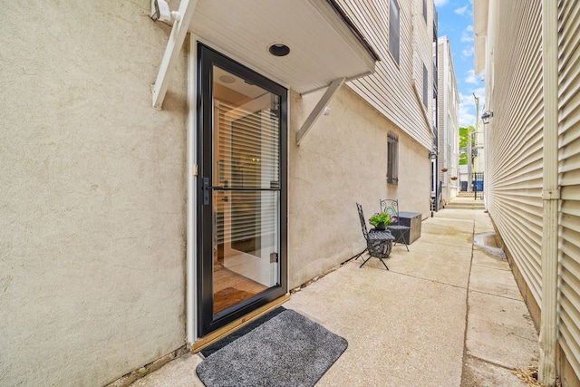 1443 N Mohawk St Unit 1, Chicago, IL 60610 - entrance to property featuring stucco siding and a patio area