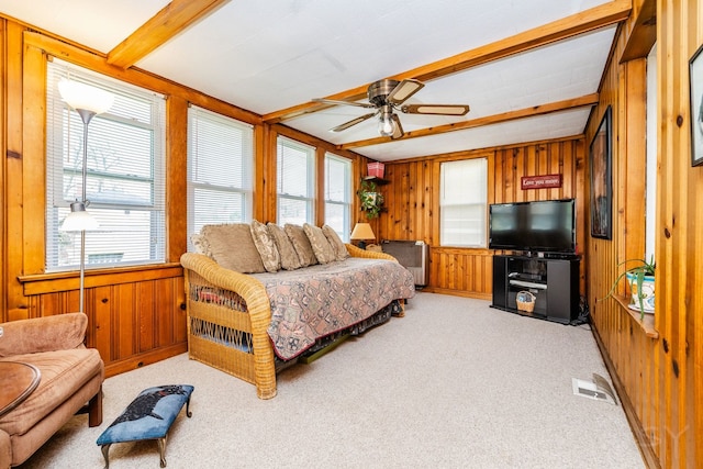 3730 Wenonah Ave, Berwyn, IL 60402 - carpeted bedroom featuring wooden walls, beam ceiling, and a ceiling fan
