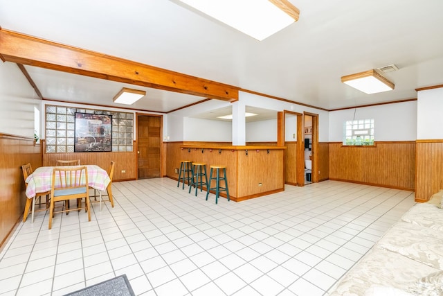 3730 Wenonah Ave, Berwyn, IL 60402 - dining space featuring wainscoting, wooden walls, and tile patterned flooring