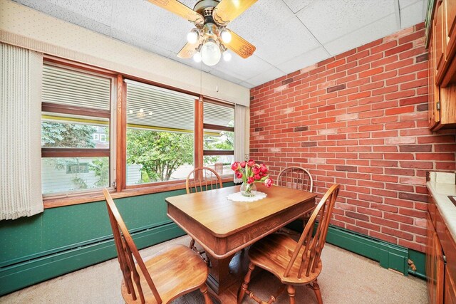 3218 Wenonah Ave, Berwyn, IL 60402 - carpeted dining space with brick wall, plenty of natural light, baseboard heating, and ceiling fan