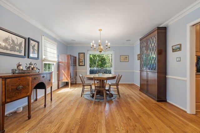 948A Shetland Dr, Frankfort, IL 60423 - dining space featuring a chandelier, ornamental molding, and light wood-style flooring