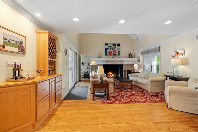 948A Shetland Dr, Frankfort, IL 60423 - living area with crown molding, light wood-style floors, a warm lit fireplace, and recessed lighting