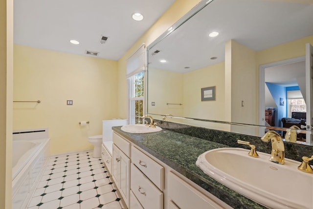 948A Shetland Dr, Frankfort, IL 60423 - bathroom with plenty of natural light, double vanity, a garden tub, tile patterned floors, and recessed lighting
