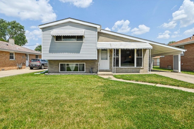 1127 Herbert Ave, Berkeley, IL 60163 - view of front facade with a front yard, driveway, a carport, and brick siding