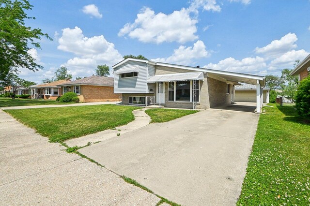 1127 Herbert Ave, Berkeley, IL 60163 - split level home with a front lawn, concrete driveway, a carport, and brick siding