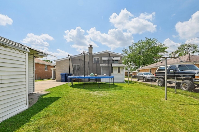 1127 Herbert Ave, Berkeley, IL 60163 - view of green lawn with a trampoline