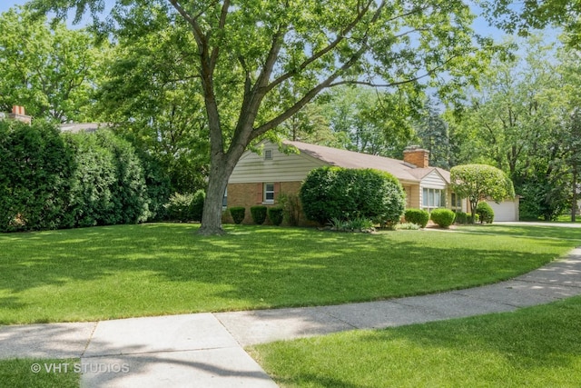 2601 Gordon Dr, Flossmoor, IL 60422 - view of front of property with a front yard, a chimney, and an attached garage