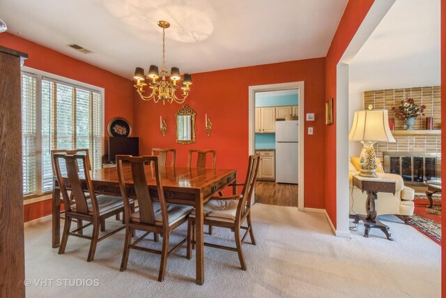 2601 Gordon Dr, Flossmoor, IL 60422 - dining space featuring a chandelier, healthy amount of natural light, and light colored carpet