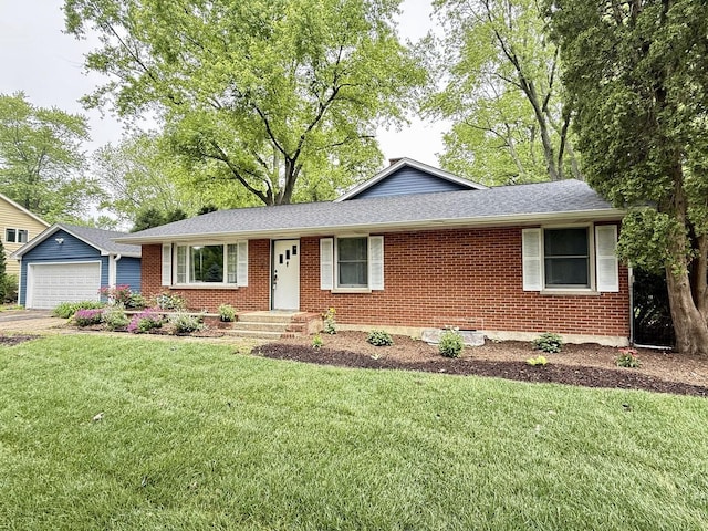 1907 S St, Geneva, IL 60134 - single story home featuring brick siding, a front yard, and a detached garage