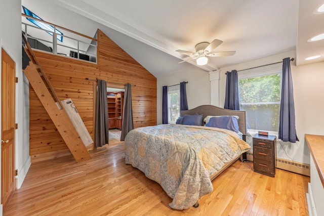 1907 S St, Geneva, IL 60134 - bedroom featuring wooden walls, vaulted ceiling, a baseboard radiator, light wood finished floors, and ceiling fan