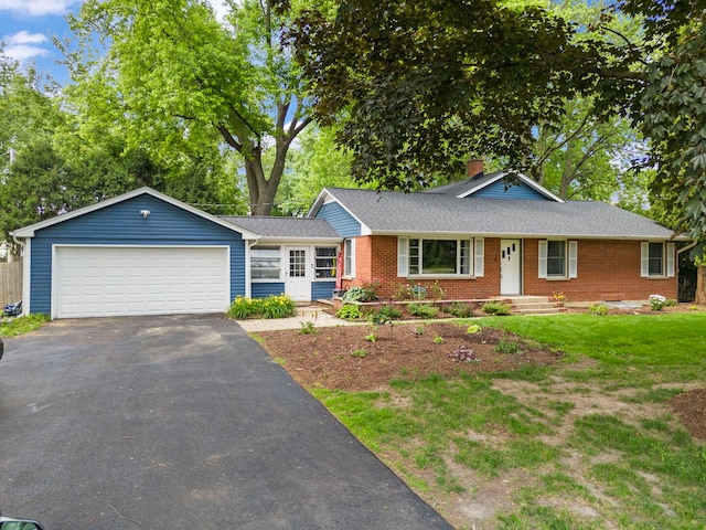 1907 S St, Geneva, IL 60134 - ranch-style home featuring brick siding, a chimney, driveway, a front yard, and roof with shingles