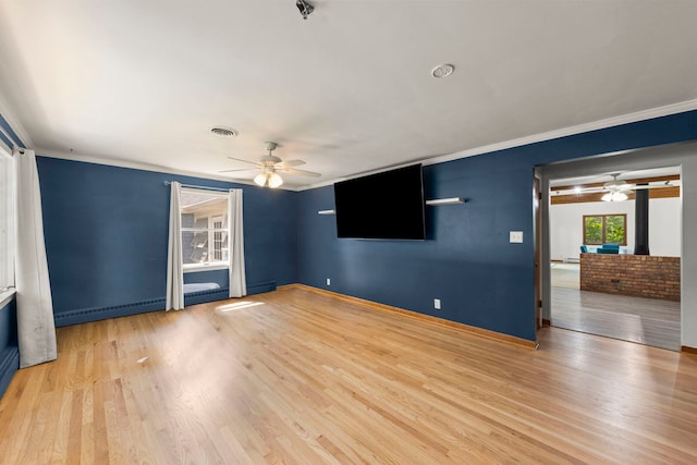 1907 S St, Geneva, IL 60134 - unfurnished living room featuring a ceiling fan, wood finished floors, baseboard heating, and ornamental molding