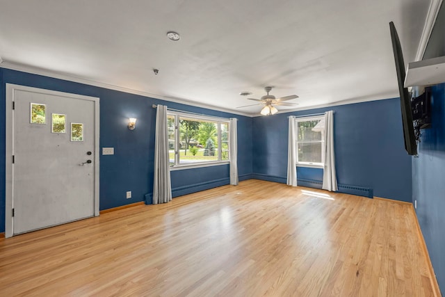 1907 S St, Geneva, IL 60134 - unfurnished living room featuring a ceiling fan, wood finished floors, ornamental molding, and a baseboard heating unit