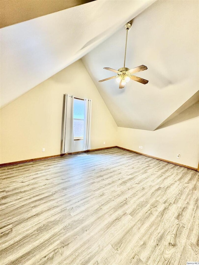 732 S 13th, Quincy, IL 62301 - bonus room featuring baseboards, ceiling fan, lofted ceiling, and wood finished floors