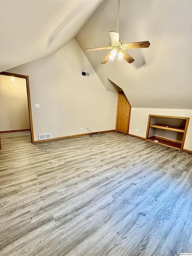 732 S 13th, Quincy, IL 62301 - bonus room featuring vaulted ceiling, ceiling fan, baseboards, and light wood finished floors