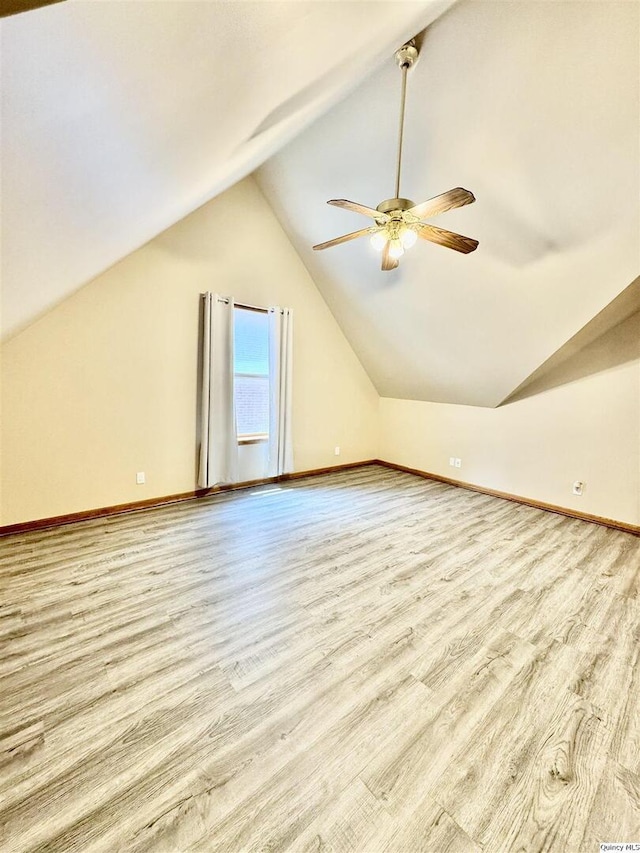 732 S 13th, Quincy, IL 62301 - bonus room featuring a ceiling fan, lofted ceiling, wood finished floors, and baseboards