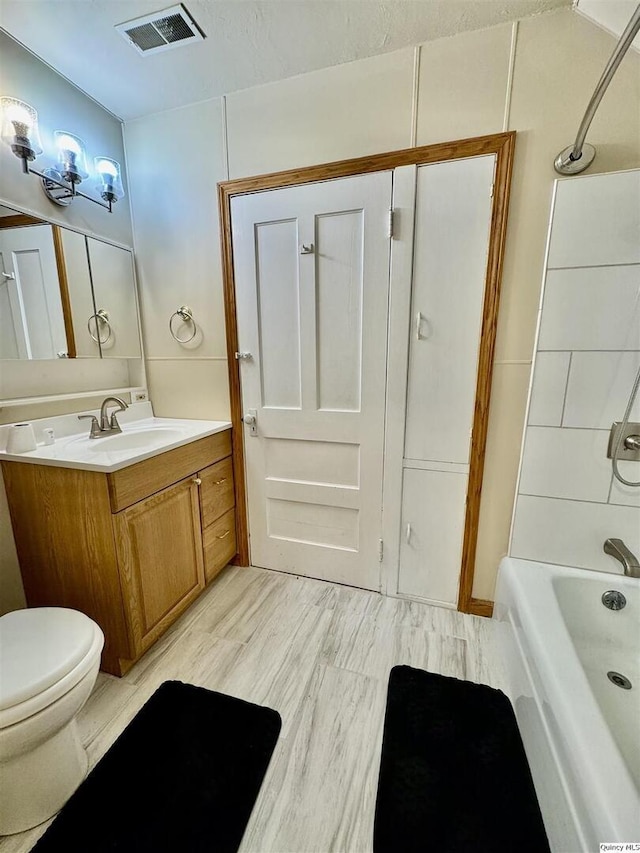 732 S 13th, Quincy, IL 62301 - bathroom featuring toilet, vanity, and shower / bath combination