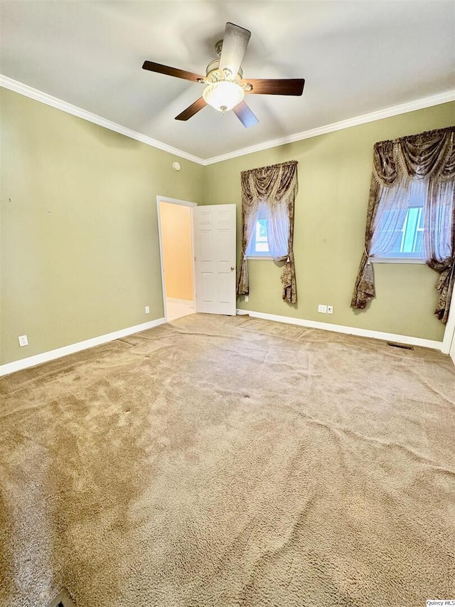 732 S 13th, Quincy, IL 62301 - unfurnished bedroom with ornamental molding, baseboards, carpet flooring, and a ceiling fan