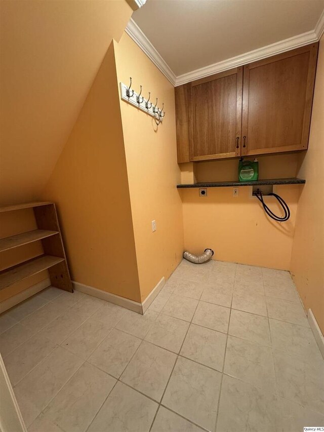 732 S 13th, Quincy, IL 62301 - washroom with cabinet space, electric dryer hookup, light tile patterned floors, crown molding, and baseboards