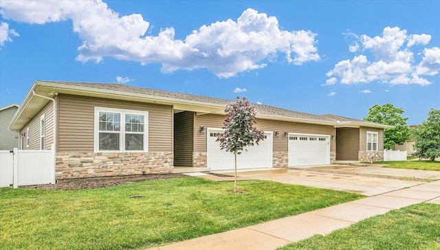 3311 Memory Ln, Urbana, IL 61802 - view of front of property with stone siding, an attached garage, and driveway