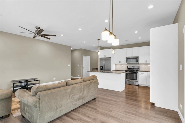 3311 Memory Ln, Urbana, IL 61802 - living area featuring ceiling fan, wood finished floors, recessed lighting, and baseboards