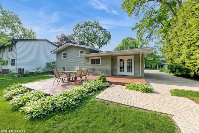2510 Timber Ln, Lindenhurst, IL 60046 - back of property featuring a deck, french doors, a lawn, and outdoor dining space